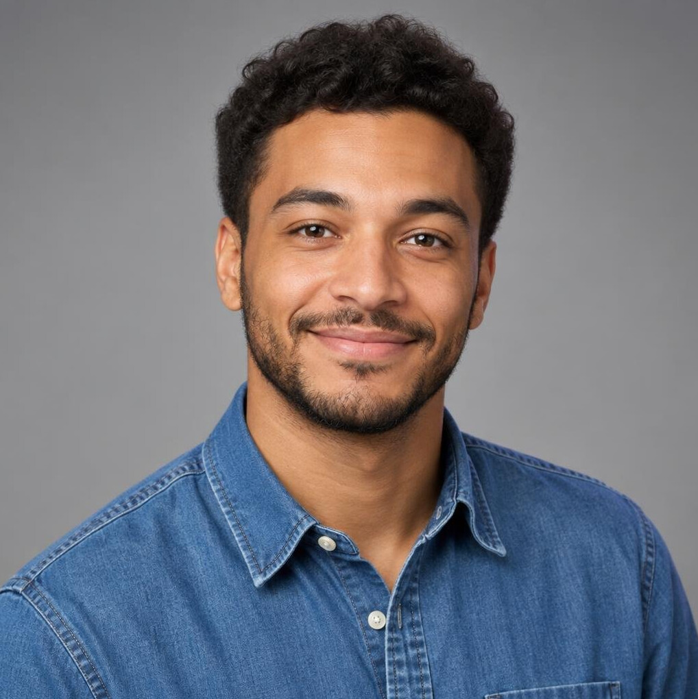 Studio portrait of a mixed race British man in a denim shirt